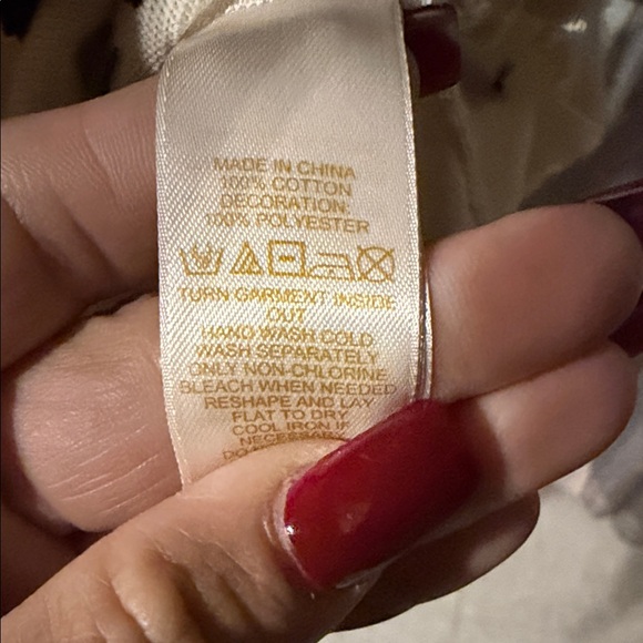 Kate Spade Ruthie Bow Cardigan in cream with black bows. - Picture 8 of 8